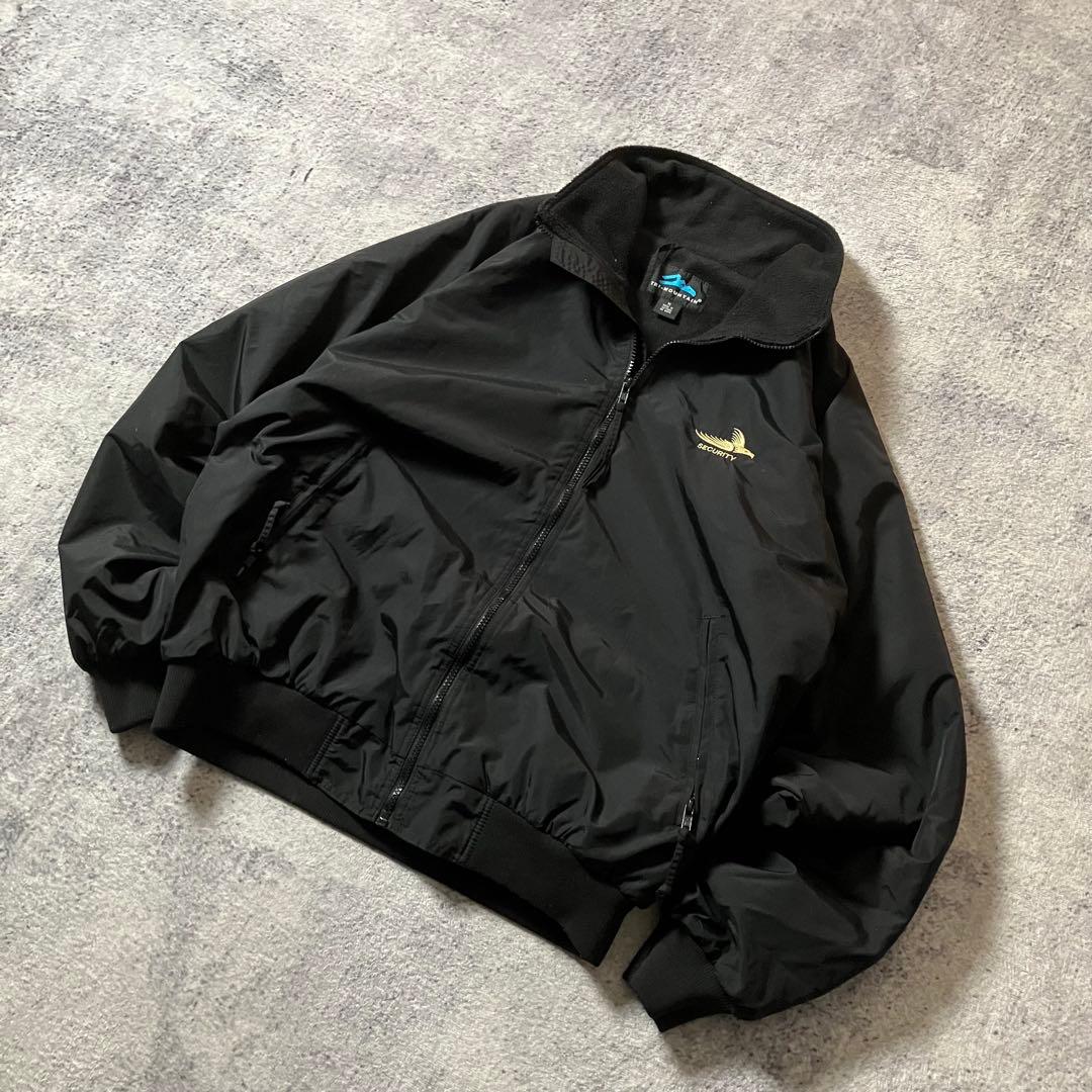 00sTRIMOUNTAIN企業ロゴウォームアップジャケットナイロンブラック黒M