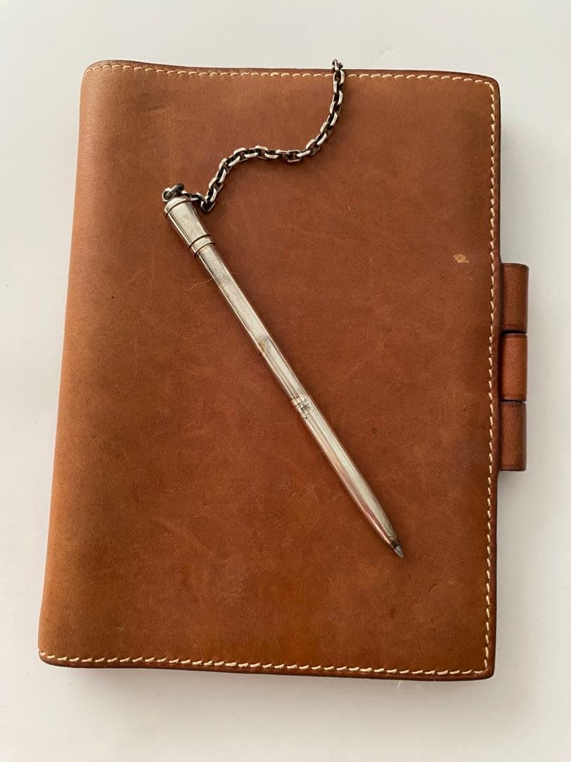 エルメス茶色い革手帳ボールペン付き