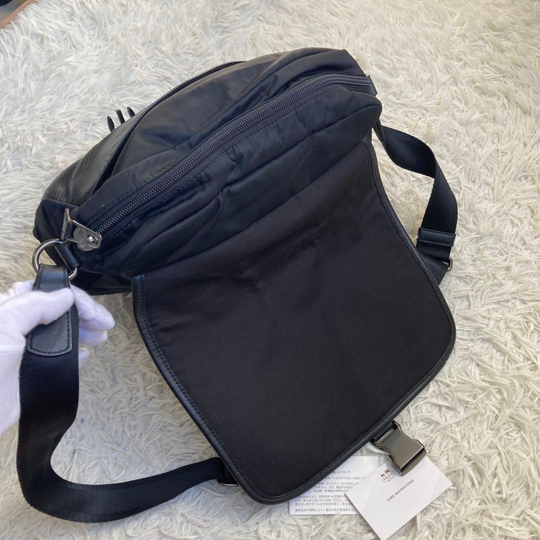 COACH フライトバッグ 黒 ブラック パンチング レザー 革 バックル