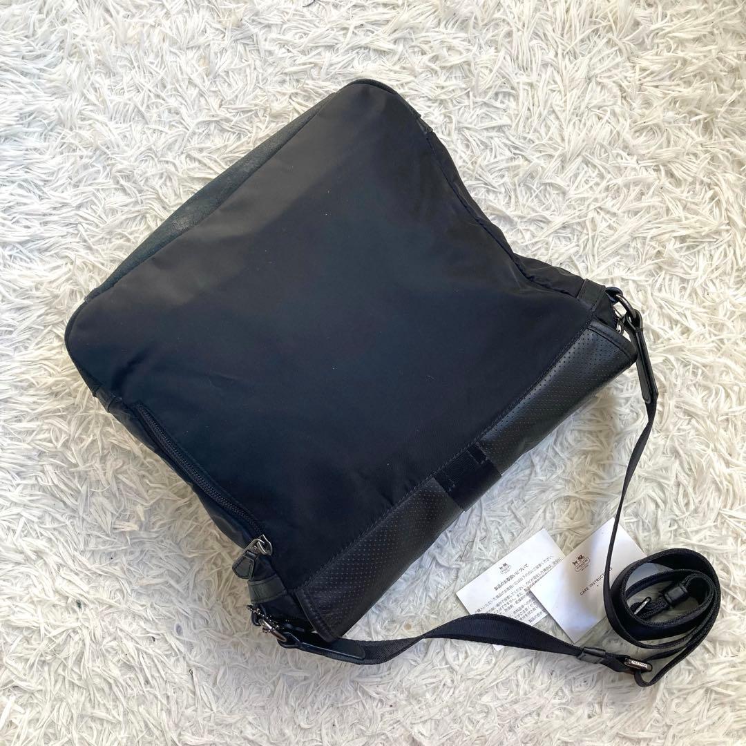 COACH フライトバッグ 黒 ブラック パンチング レザー 革 バックル