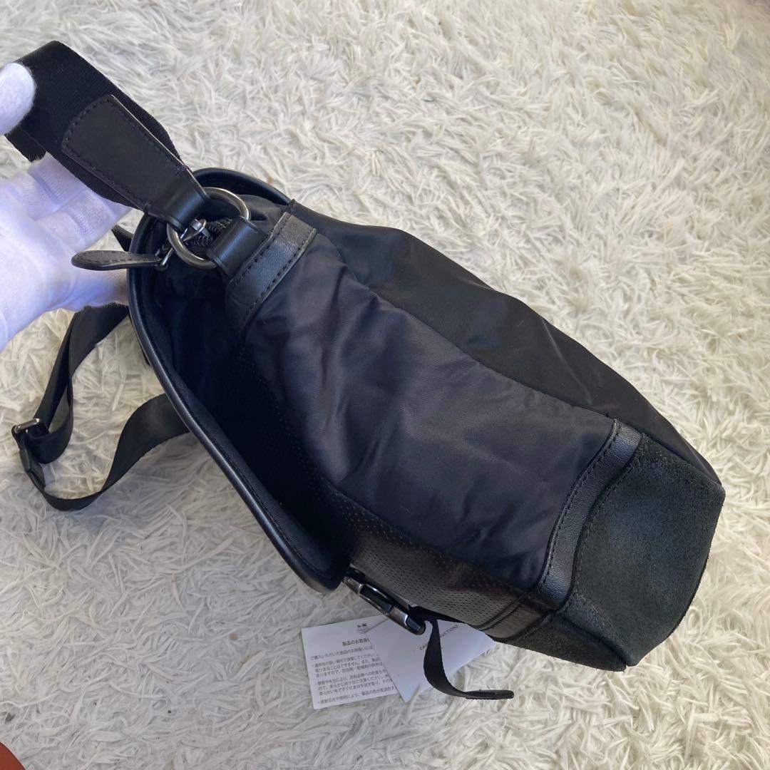 COACH フライトバッグ 黒 ブラック パンチング レザー 革 バックル