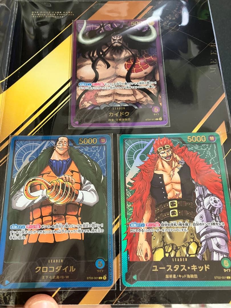ワンピースカード　プレミアムコレクション等7冊未開封プロモ付25周年REDリーダ