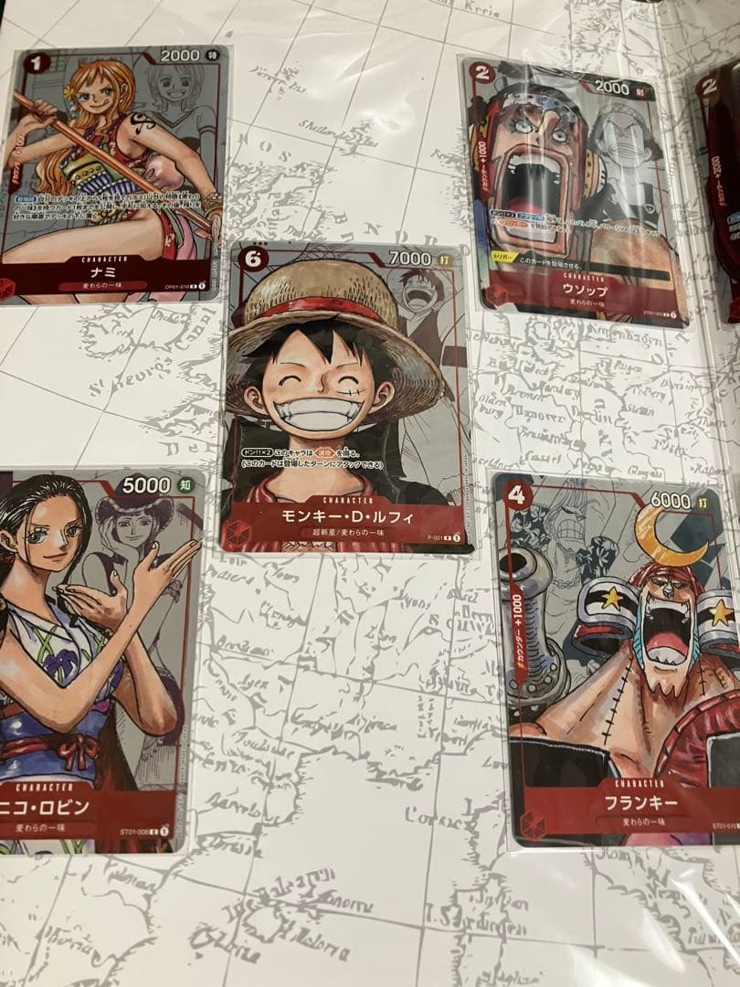 ワンピースカード　プレミアムコレクション等7冊未開封プロモ付25周年REDリーダ
