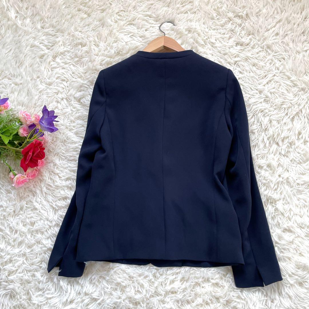 PLSTプラステ ネイビーノーカラージャケットパンツスーツセットアップ洗える