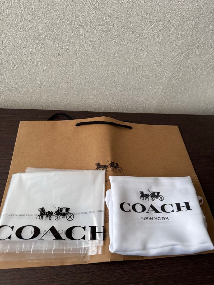 R*様 COACH ブラック バックパック