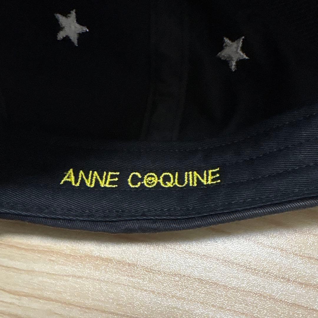 ANNE COQUINE スタッズ付きスマイリーフェイスキャップ